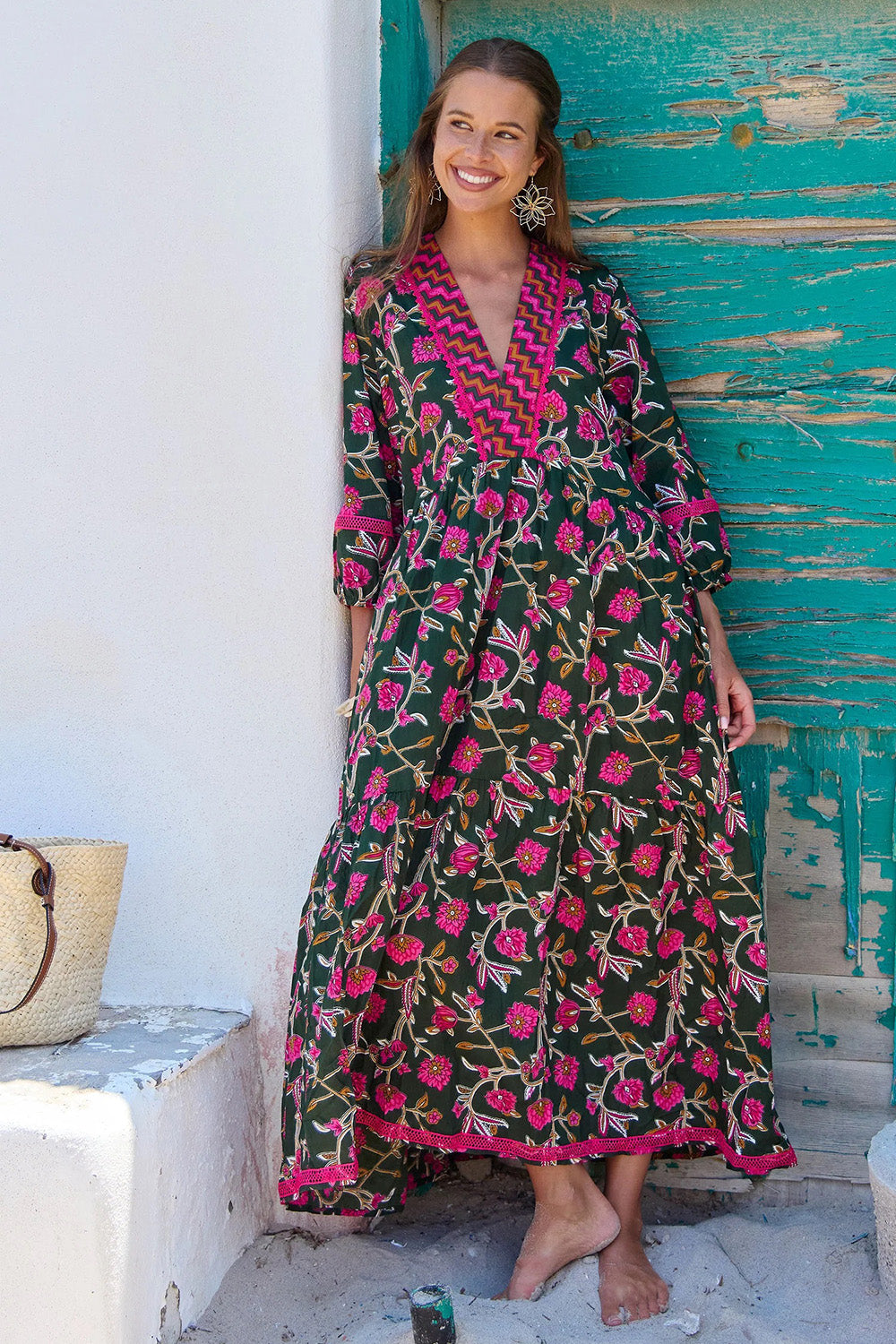A model wearing the Penny Cotton Maxi Dress in colour Jewel (Green), from the front, showing the whole outfit