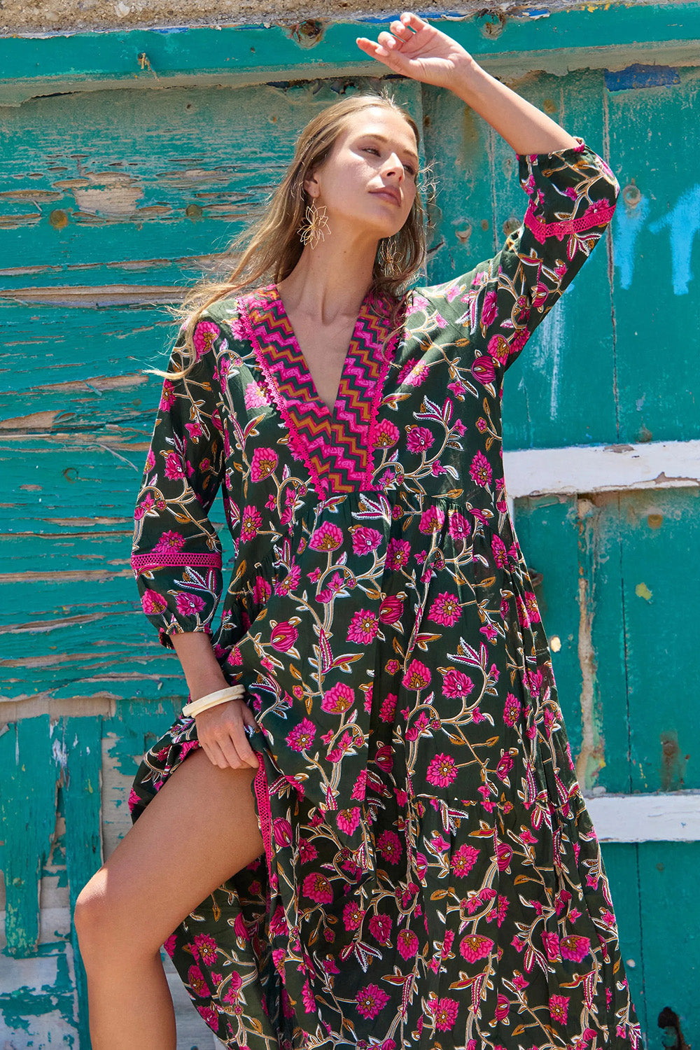 A model wearing the Penny Cotton Maxi Dress in colour Jewel (Green), from the front, showing the whole outfit