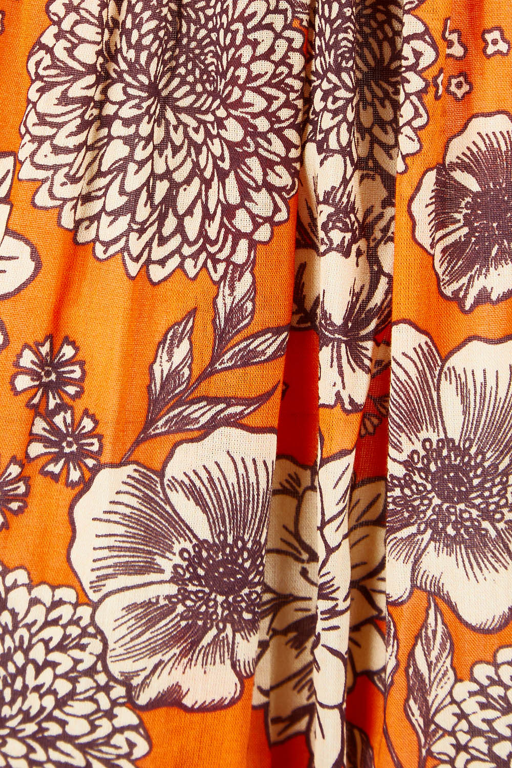Product shot of the Leela Dress in colour Orange, detail