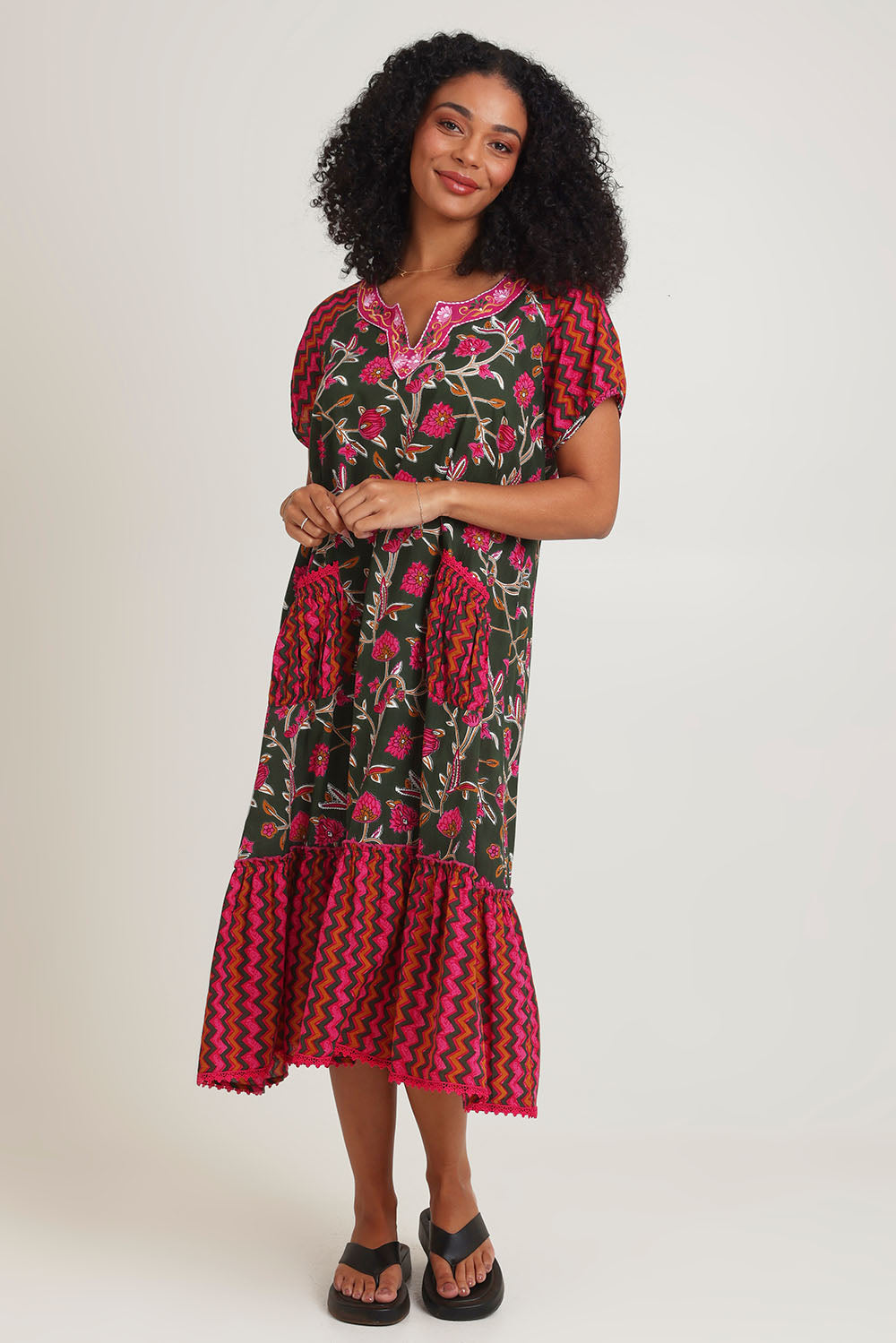 Model Ziara wearing size S of the Sao Paulo Cotton Midi Dress in colour Jewel (Green), from the front, showing the whole outfit