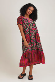 Model Ziara wearing size S of the Sao Paulo Cotton Midi Dress in colour Jewel (Green), from the front, showing the whole outfit