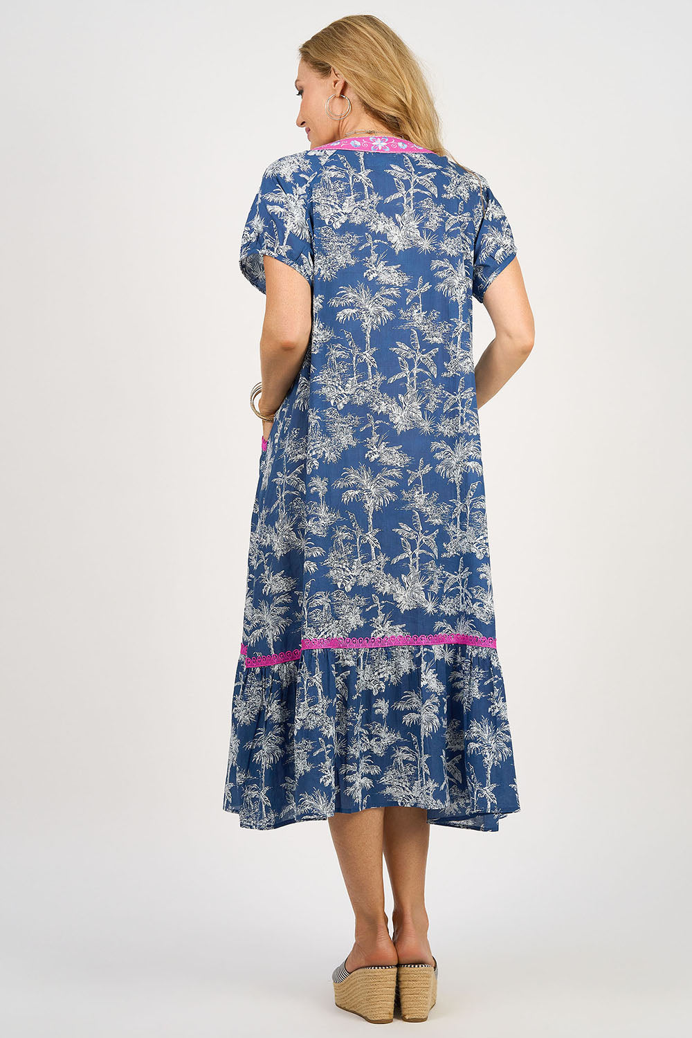 A model wearing the Sao Paulo Cotton Midi Dress in colour Oahu (Blue), from the back