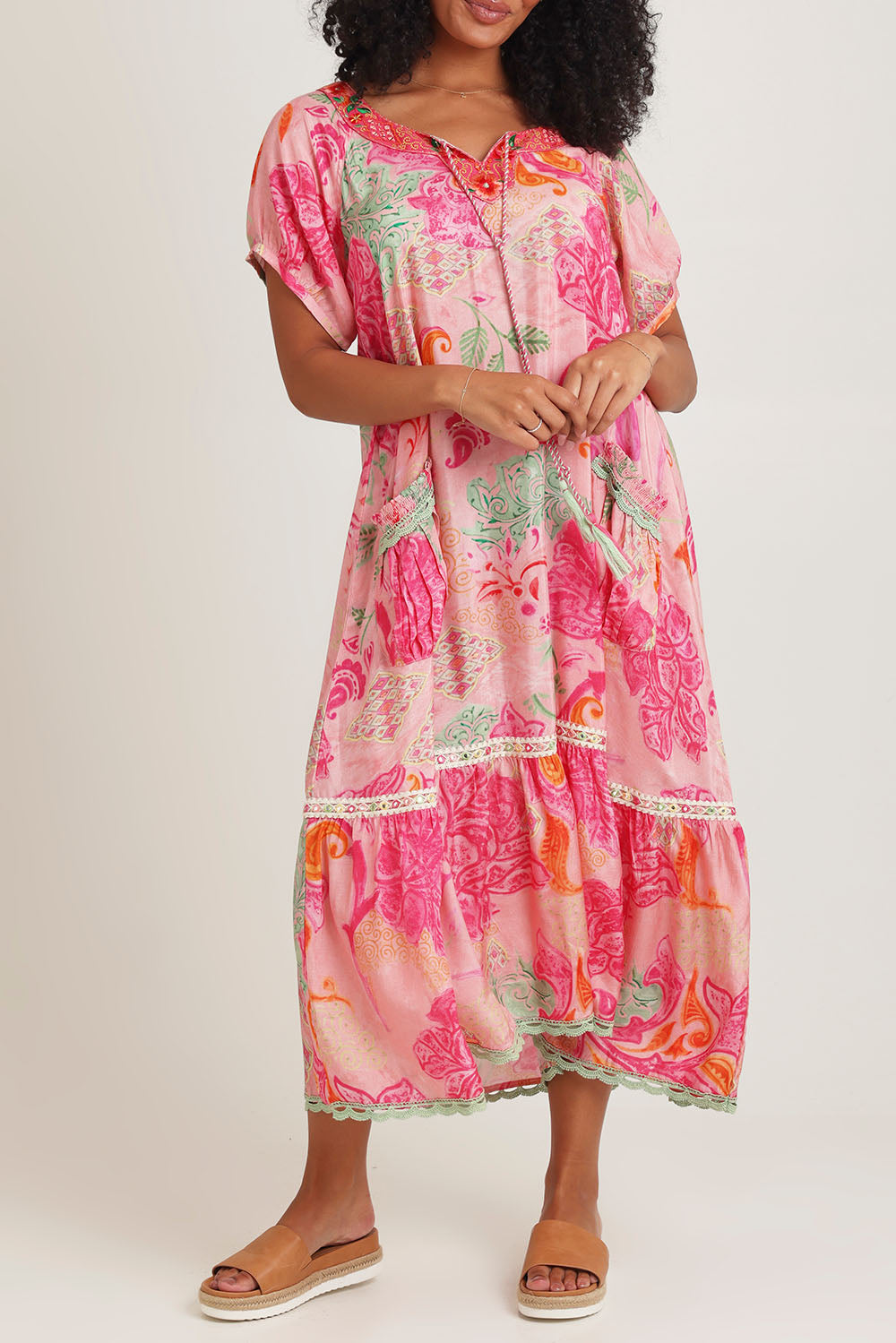 Model Ziara wearing size S of the Sao Paulo Maxi Dress in colour Charlise (Pink), from the front, cropped image