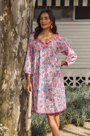 Model Genericm wearing size sample of the Sao Paulo Cotton Dress – Cupcake in colour Cupcake, from an angle