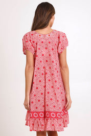 Model Madelinec wearing size 10 of the Sao Paulo Cotton Dress – Jasminewhite in colour Jasminewhite, from the back