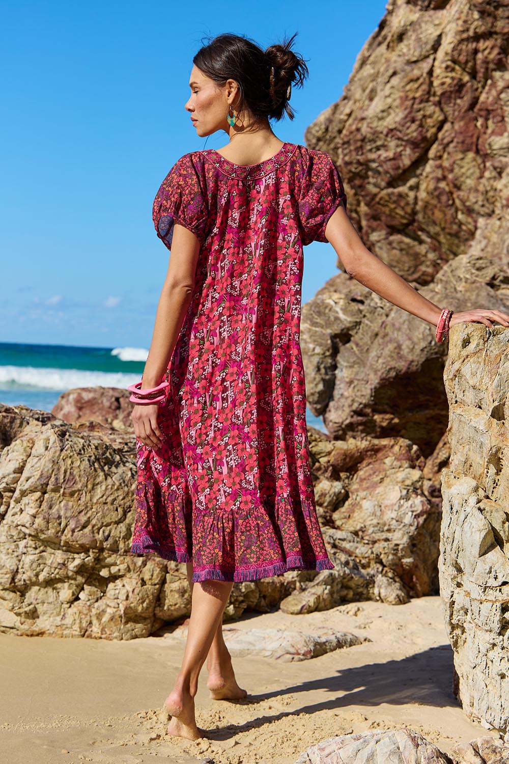 A model wearing the Sao Paulo Cotton Dress in colour Oasispink (Pink), from the back