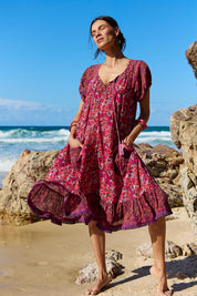A model wearing the Sao Paulo Cotton Dress in colour Oasispink (Pink), from the front, showing the whole outfit