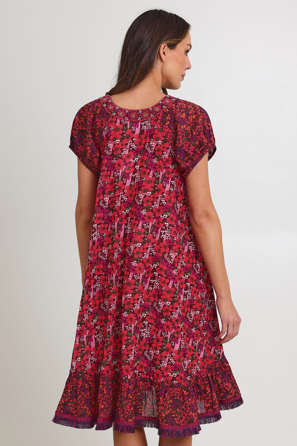 Model Madeline wearing size S of the Sao Paulo Cotton Dress in colour Oasispink (Pink), from the back
