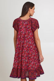Model Madeline wearing size S of the Sao Paulo Cotton Dress in colour Oasispink (Pink), from the back