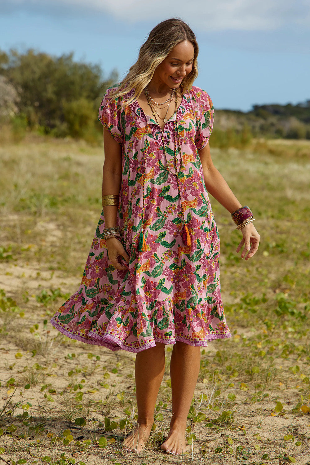 A model wearing the Sao Paulo Cotton Dress in colour Panama (Pink), from the front, showing the whole outfit
