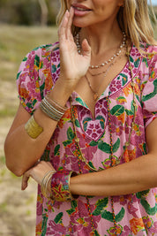 A model wearing the Sao Paulo Cotton Dress in colour Panama (Pink), from the front, showing the whole outfit