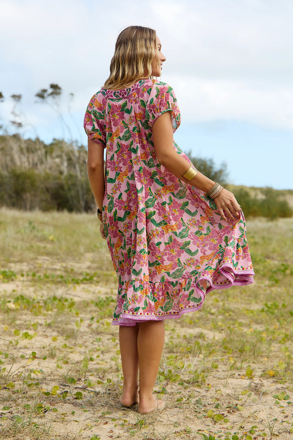 A model wearing the Sao Paulo Cotton Dress in colour Panama (Pink), from the front, showing the whole outfit