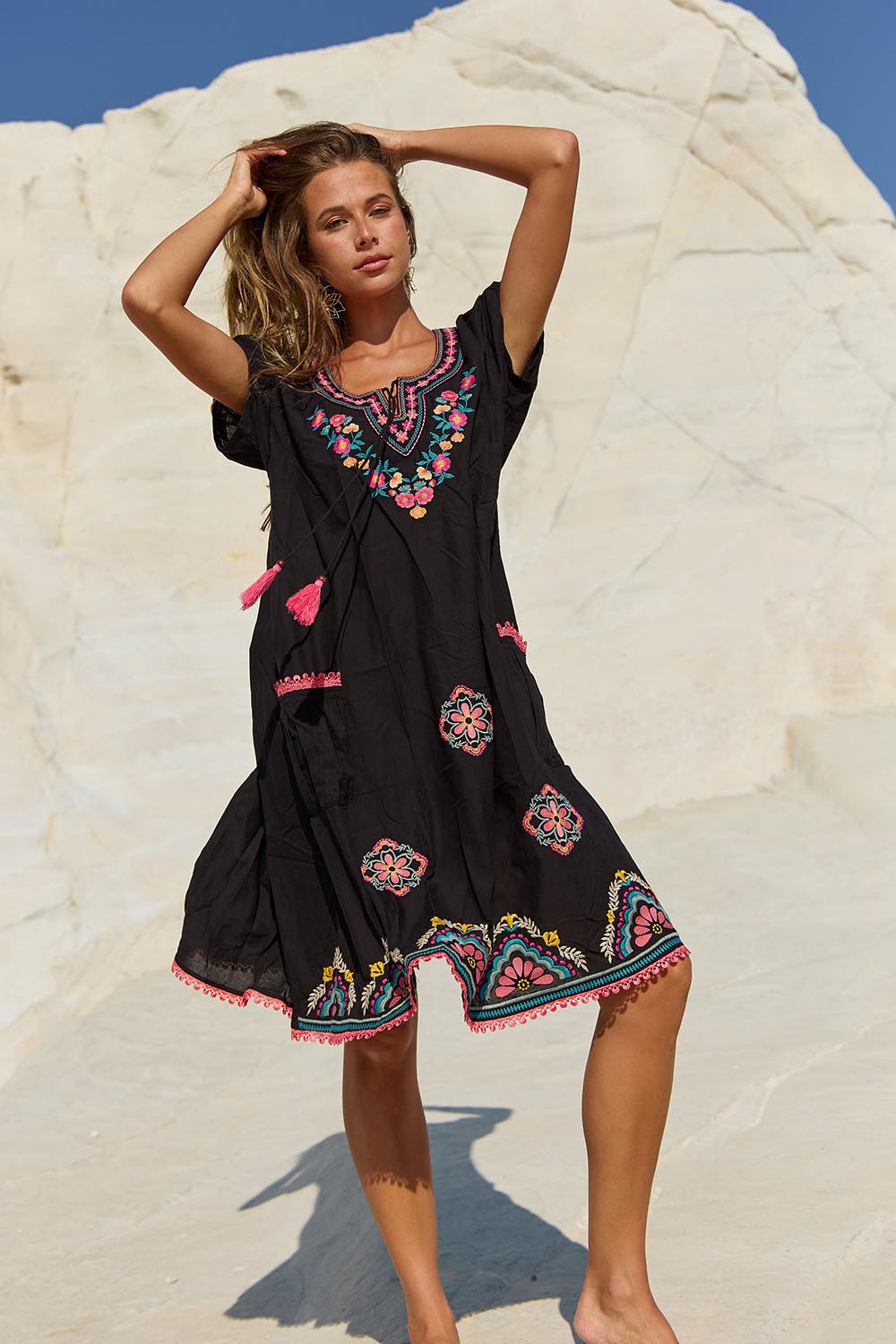 A model wearing the Sao Paulo Cotton Dress in colour Rubyblk (Black), from the front, showing the whole outfit