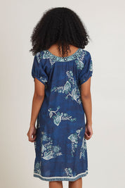 Model Ziara wearing size S of the Sao Paulo Dress in colour Selene (Blue), from the back