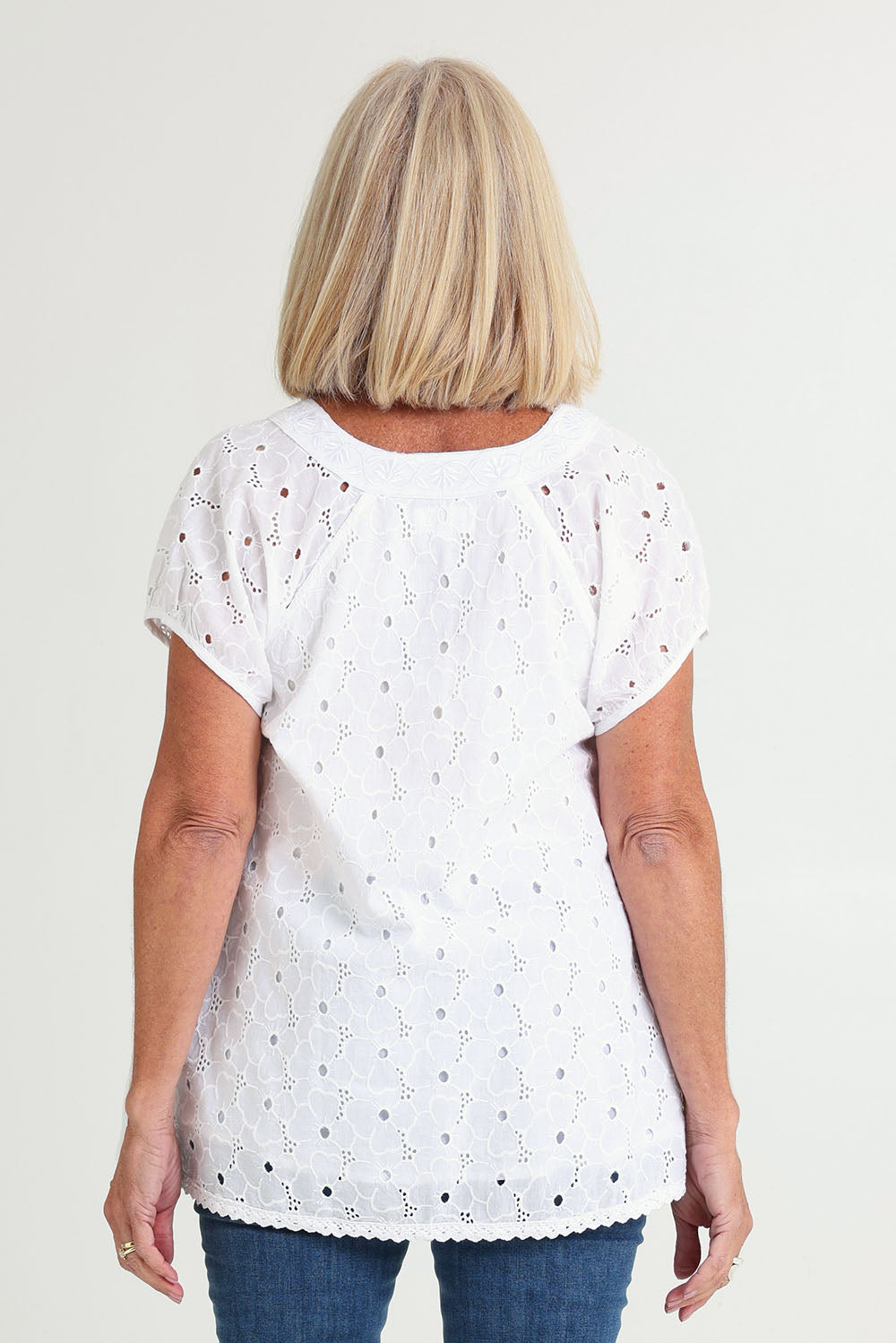 Model Sandy wearing size S of the Sao Paulo Cotton Top in colour Delight (Green), from the back