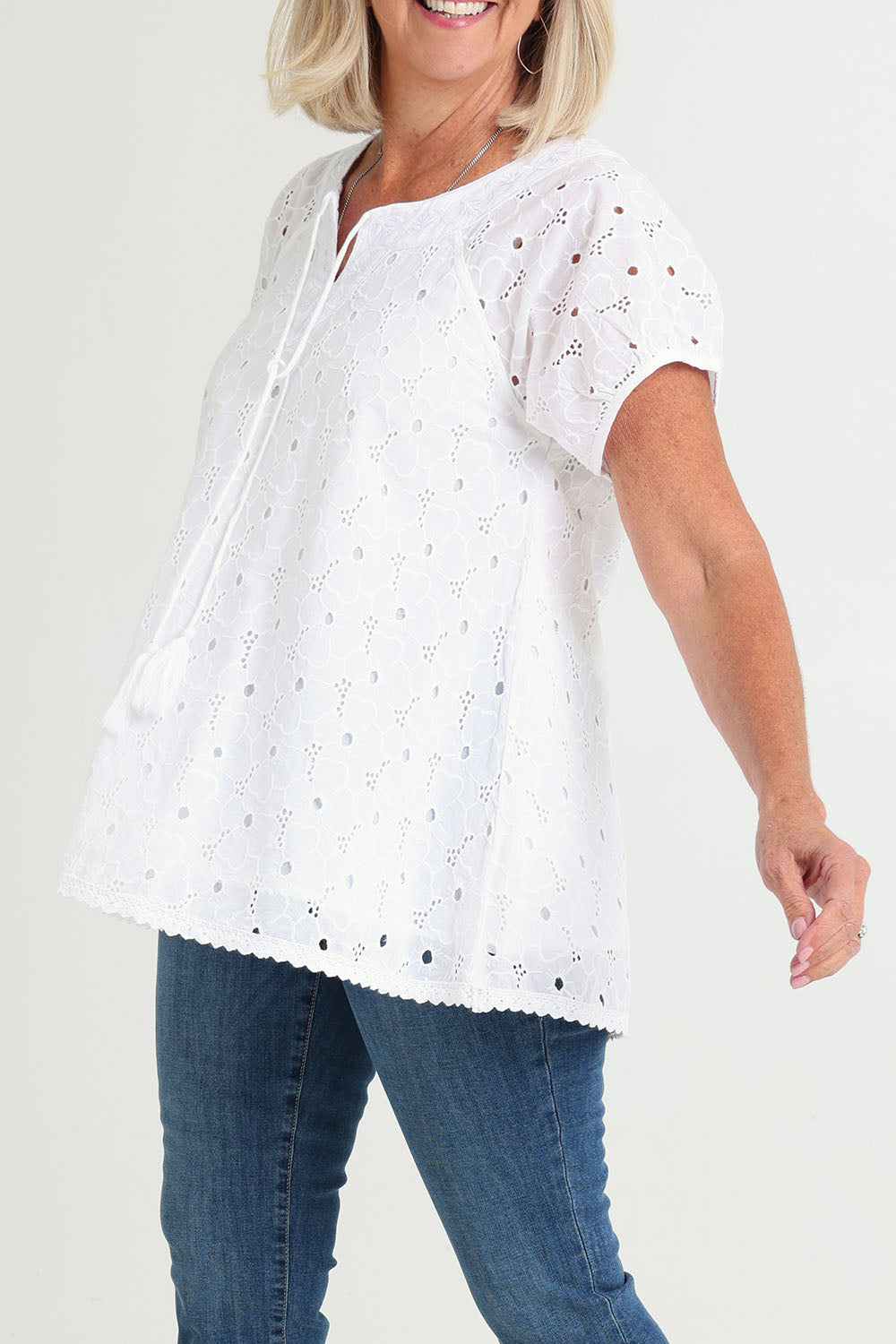 Model Sandy wearing size S of the Sao Paulo Cotton Top in colour Delight (Green), from the front, cropped image
