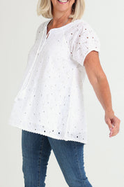 Model Sandy wearing size S of the Sao Paulo Cotton Top in colour Delight (Green), from the front, cropped image