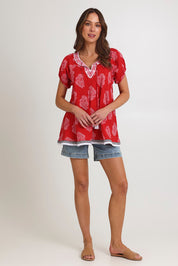 Model Madeline wearing size S of the Sao Paulo Cotton Top in colour Paisleyred (Red), from the front, showing the whole outfit