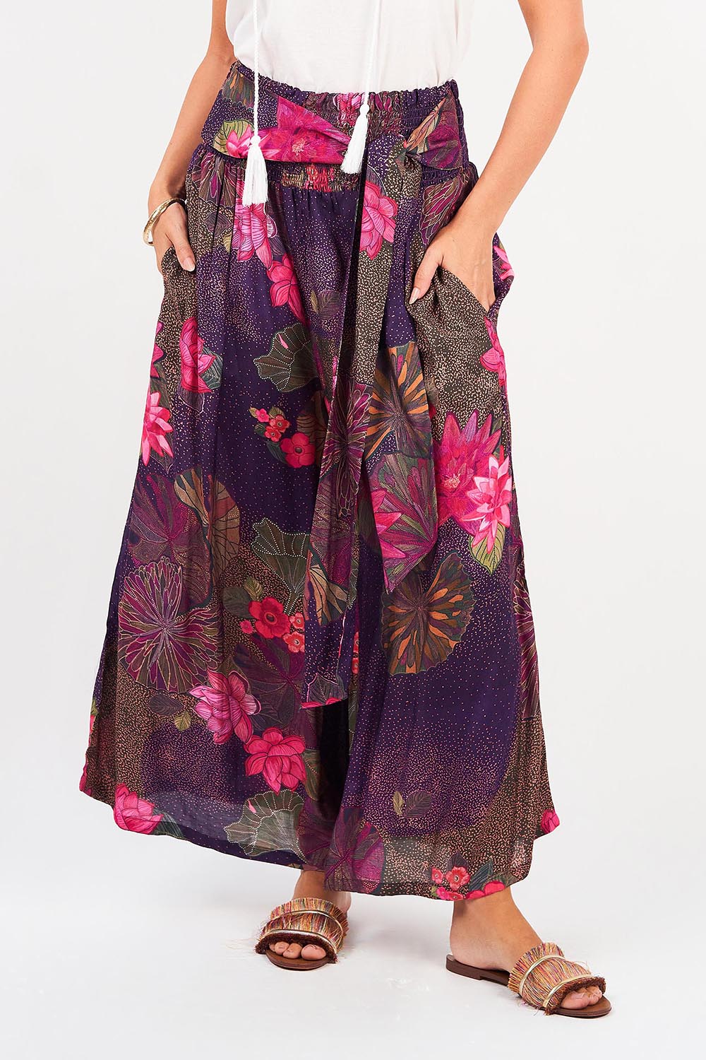 A model wearing the Hendrix Pant in colour Waterlily (Blue), from the front, cropped image