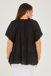 Model Georgia wearing size S of the Matilda Top in colour Black (Black), from the back