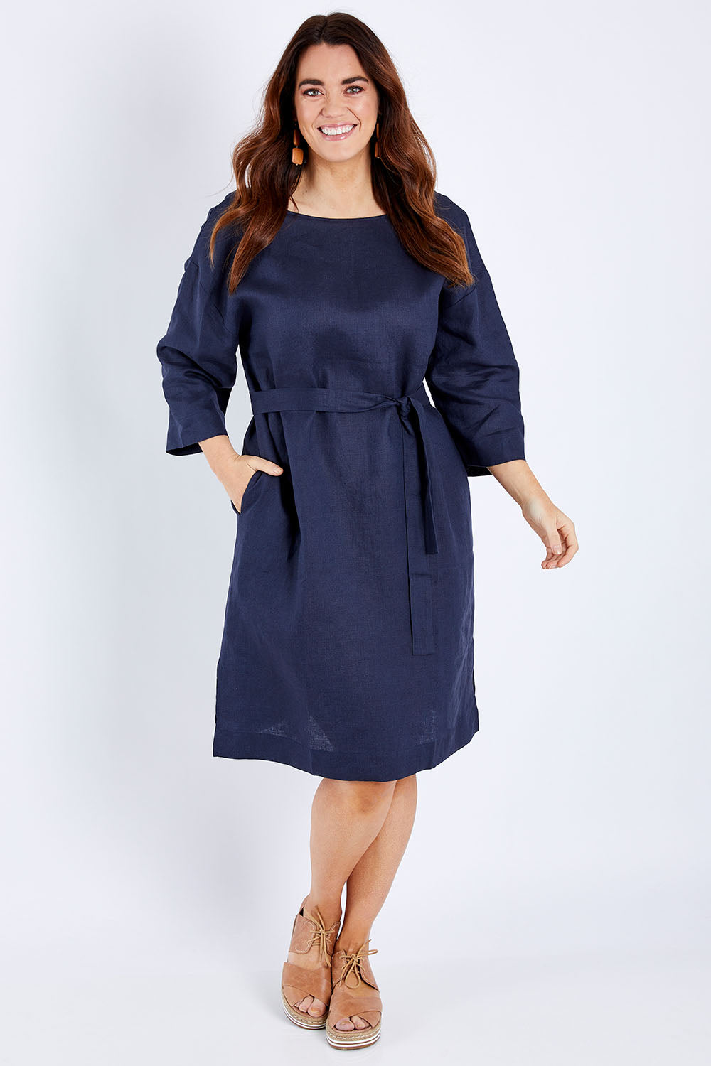 Model Laura wearing size 14 of the Linen Reversible Shift Dress in colour Ocean (Blue), from the front, showing the whole outfit