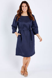 Model Laura wearing size 14 of the Linen Reversible Shift Dress in colour Ocean (Blue), from the front, showing the whole outfit
