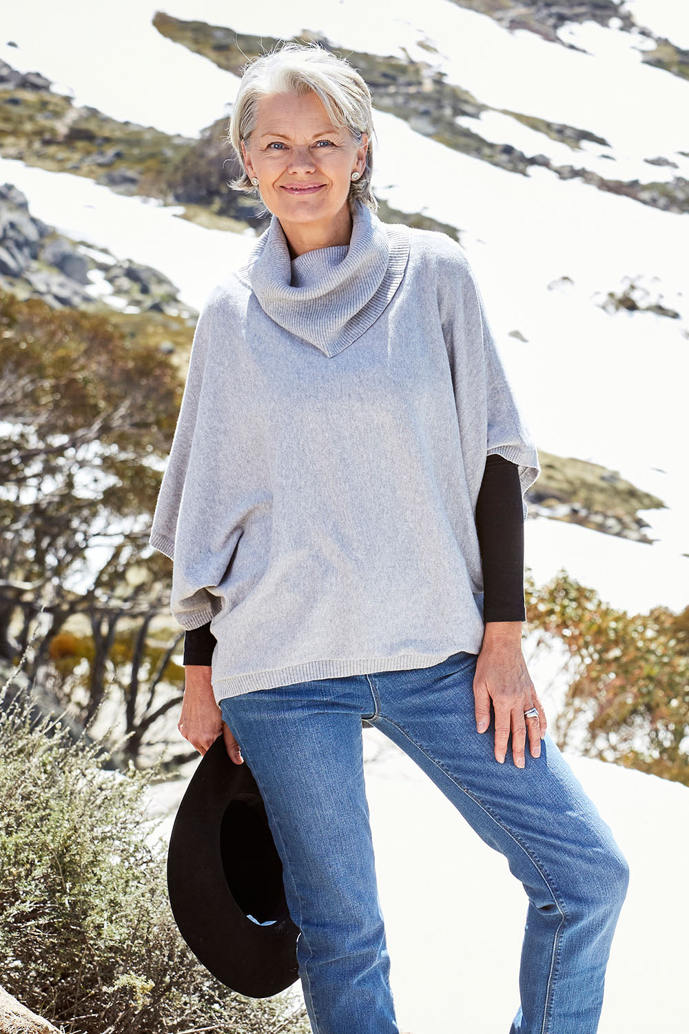 Model Charlotte wearing size S of the Natural Swing Kimono in colour Dove (Grey), from the front, showing the whole outfit