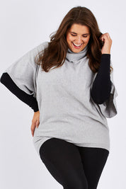 Model Mae wearing size XXL of the Natural Swing Kimono in colour Dove (Grey), from the front, cropped image