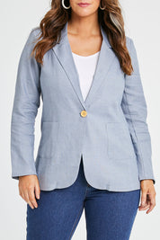 Model Laura wearing size 14 of the Cotton Linen Longline Blazer in colour Chambray (Blue), from the front, cropped image