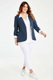 Model Laura wearing size 14 of the Cotton Linen Longline Blazer in colour Deepocean (Blue), from the front, showing the whole outfit