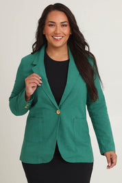 Model Ashleigh wearing size 16 of the Cotton Linen Longline Blazer in colour Green (Green), from the front, cropped image