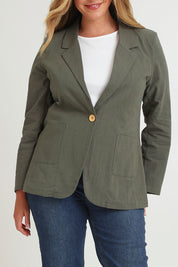 Model Chanel wearing size 16 of the Cotton Linen Longline Blazer in colour Khaki (Green), from the front, cropped image