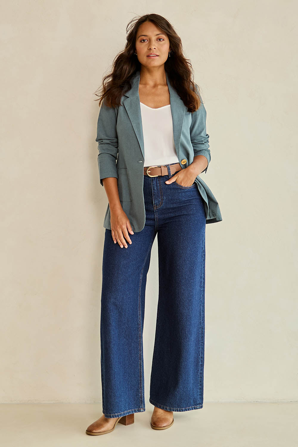 Model Tahnee wearing size 10 of the Cotton Linen Longline Blazer in colour Lagoon (Green), from the front, showing the whole outfit
