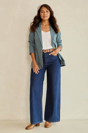 Model Tahnee wearing size 10 of the Cotton Linen Longline Blazer in colour Lagoon (Green), from the front, showing the whole outfit