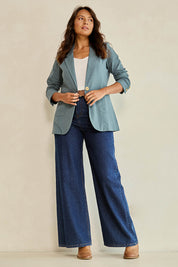 Model Tahnee wearing size 10 of the Cotton Linen Longline Blazer in colour Lagoon (Green), from the front, showing the whole outfit