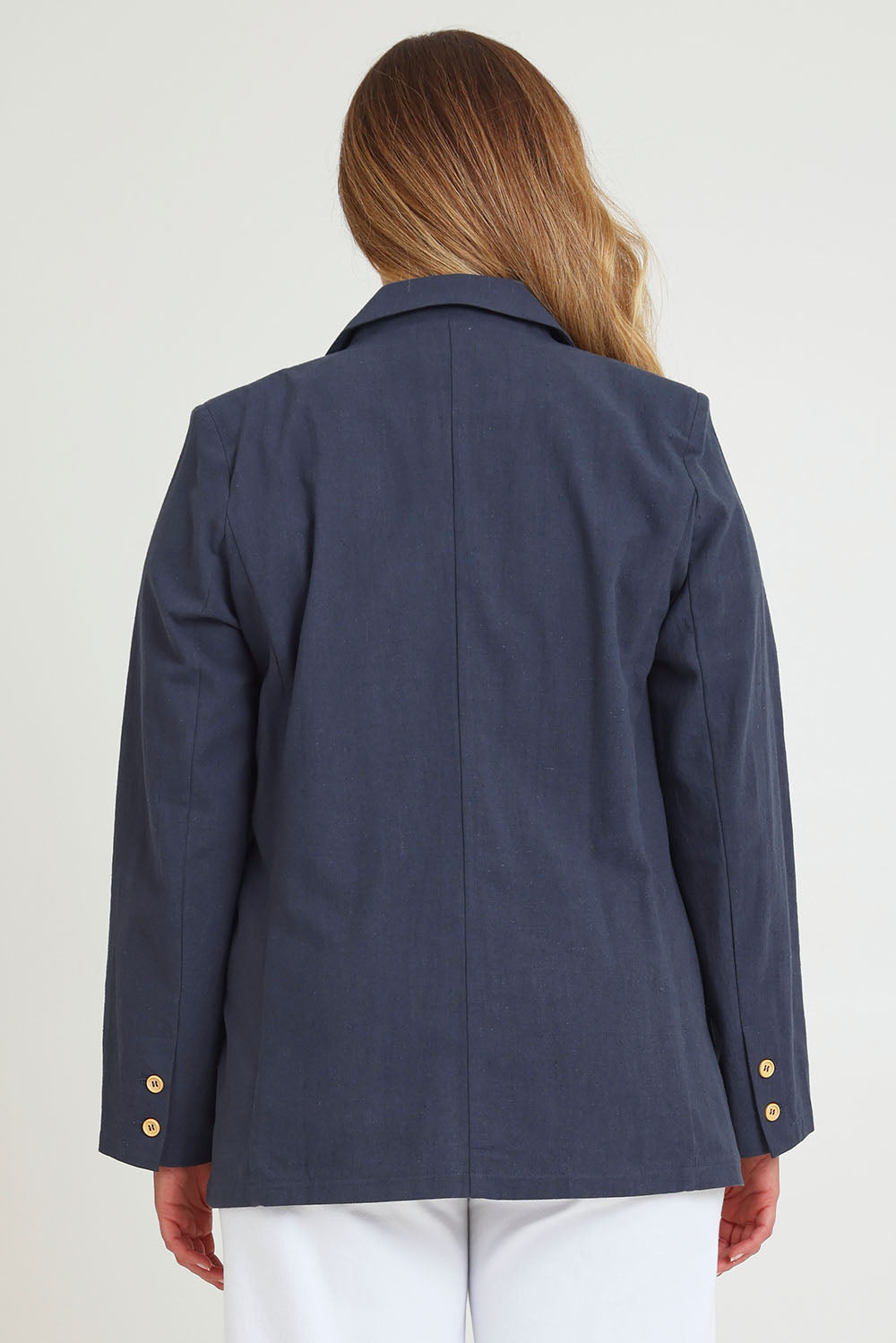 Model Chanel wearing size 16 of the Cotton Linen Longline Blazer in colour Navy (Blue), from the back