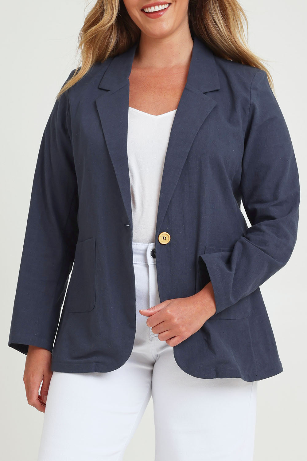 Model Chanel wearing size 16 of the Cotton Linen Longline Blazer in colour Navy (Blue), from the front, cropped image