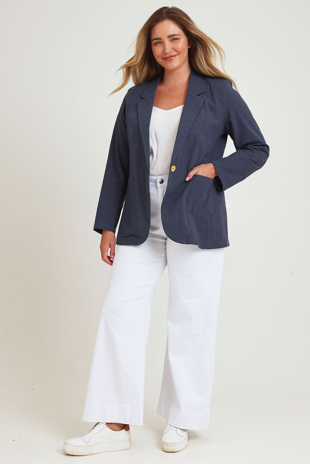 Model Chanel wearing size 16 of the Cotton Linen Longline Blazer in colour Navy (Blue), from the front, showing the whole outfit