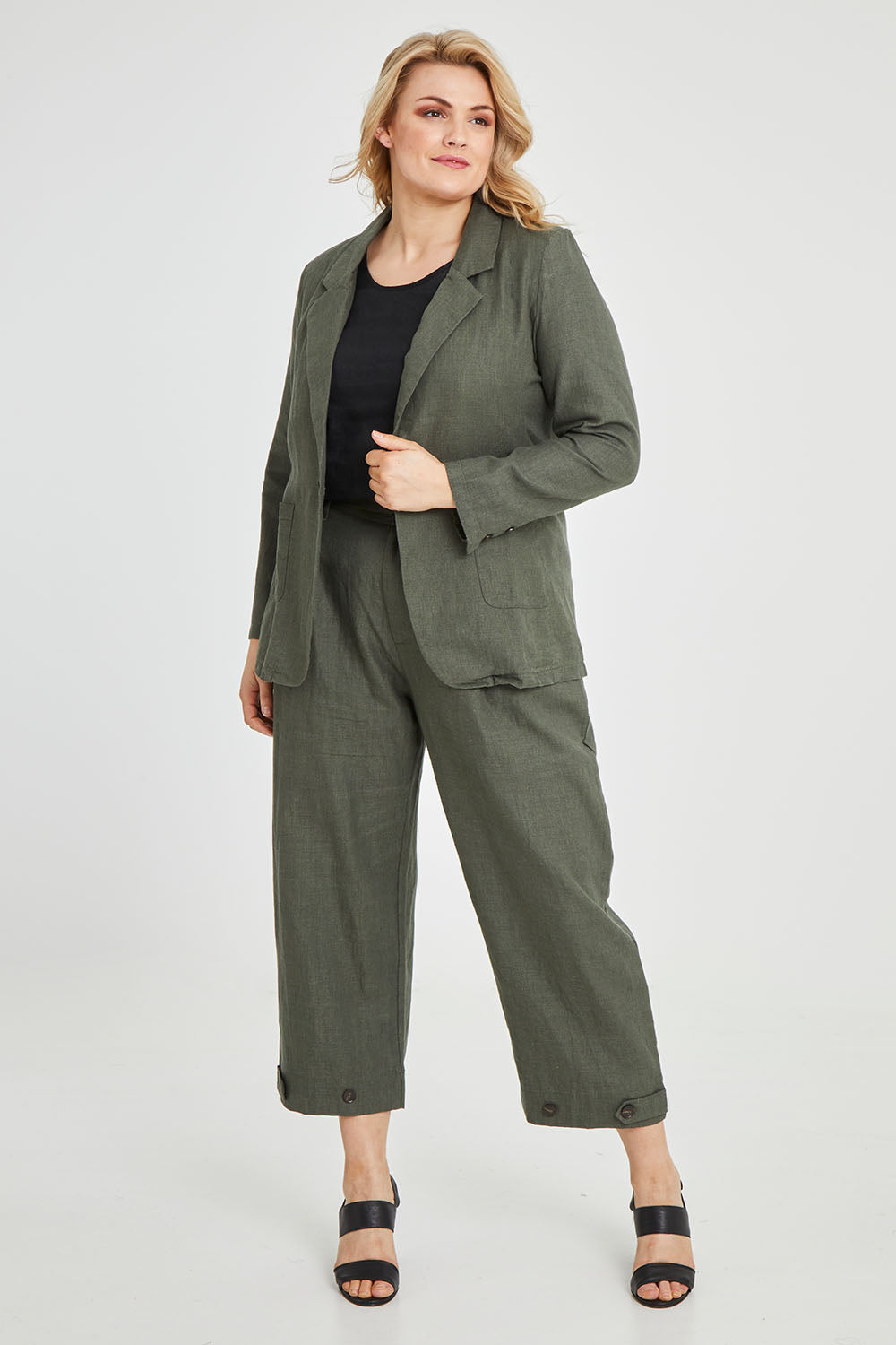Model Keeara wearing size 16 of the Cotton Linen Longline Blazer in colour Olive (Green), from the front, showing the whole outfit