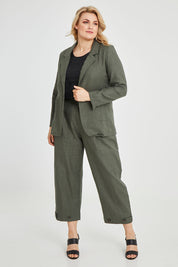Model Keeara wearing size 16 of the Cotton Linen Longline Blazer in colour Olive (Green), from the front, showing the whole outfit