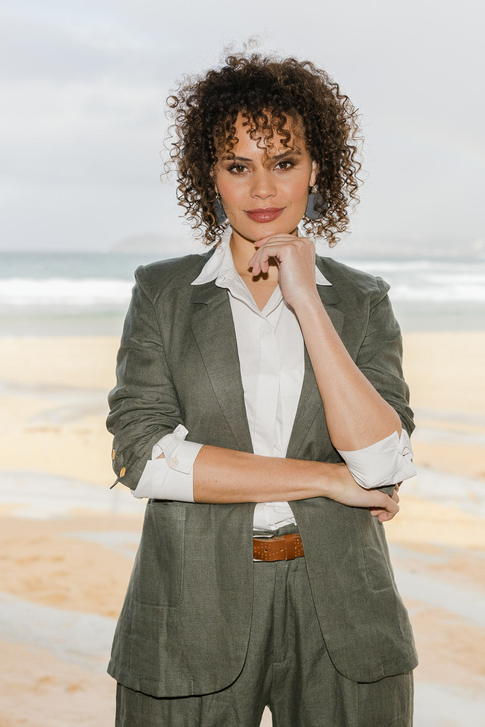 Model Lala wearing size 10 of the Cotton Linen Longline Blazer in colour Olive (Green), from the front, showing the whole outfit