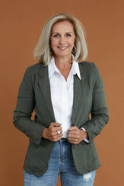 Model Sandy wearing size 10 of the Cotton Linen Longline Blazer in colour Olive (Green), from the front, cropped image