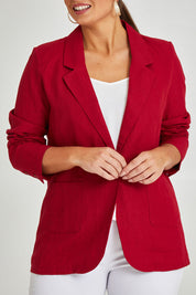 Model Monique wearing size 14 of the Cotton Linen Longline Blazer in colour Red (Red), from the front, cropped image