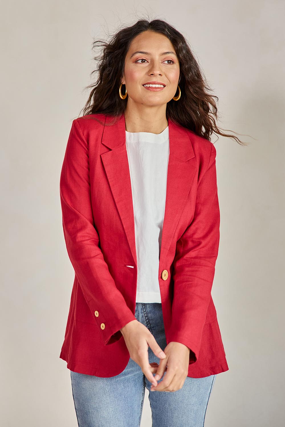 Model Tahneei wearing size 10 of the Cotton Linen Longline Blazer – Red in colour Red, in a cropped view