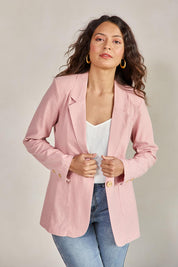 Model Tahneei wearing size 10 of the Cotton Linen Longline Blazer – Softblush in colour Softblush, in a cropped view