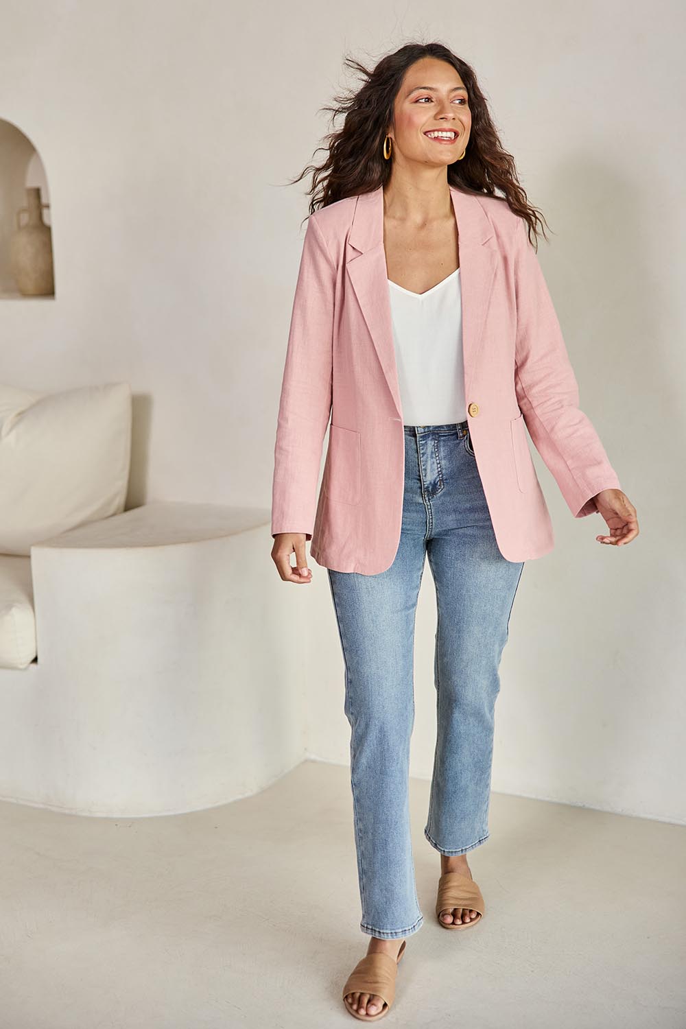 Model Tahneei wearing size 10 of the Cotton Linen Longline Blazer – Softblush in colour Softblush, from the front