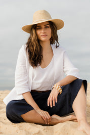 Model Ilona wearing size 10 of the Linen 3/4 Sleeve Blazer in colour Meringue (White), from the front, showing the whole outfit