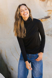 Model Amanda wearing size 10 of the Merino Wool Skivvy in colour Black (Black), from the front, showing the whole outfit