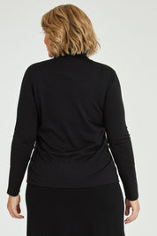 Model Fiona wearing size 16 of the Merino Wool Skivvy in colour Black (Black), from the back