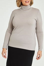 Model Fiona wearing size 16 of the Merino Wool Skivvy in colour Natural, from the front, cropped image